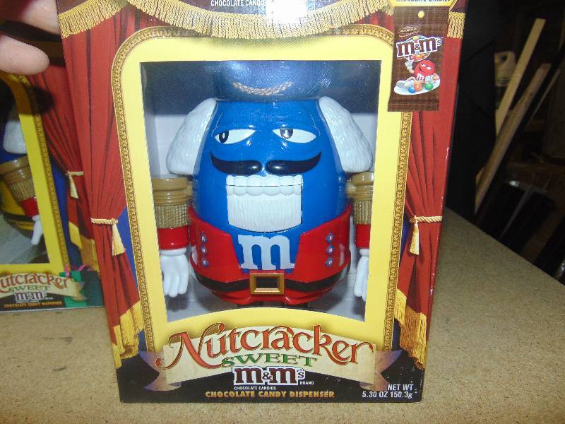 lot 4077 image: The Nutcracker Suite M&Ms Dispenser, blue with red coat, in original box