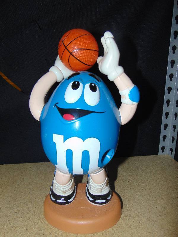lot 4110 image: Basketball Player Blue M&Ms Candy Dispenser, 13 tall, 1995