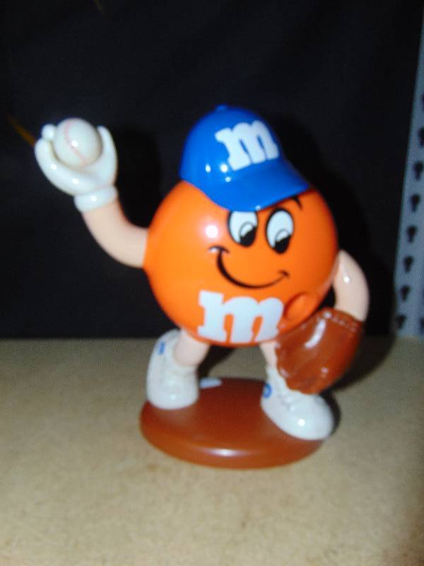 lot 4111 image: Baseball Orange M&Ms dispenser, 9 tall