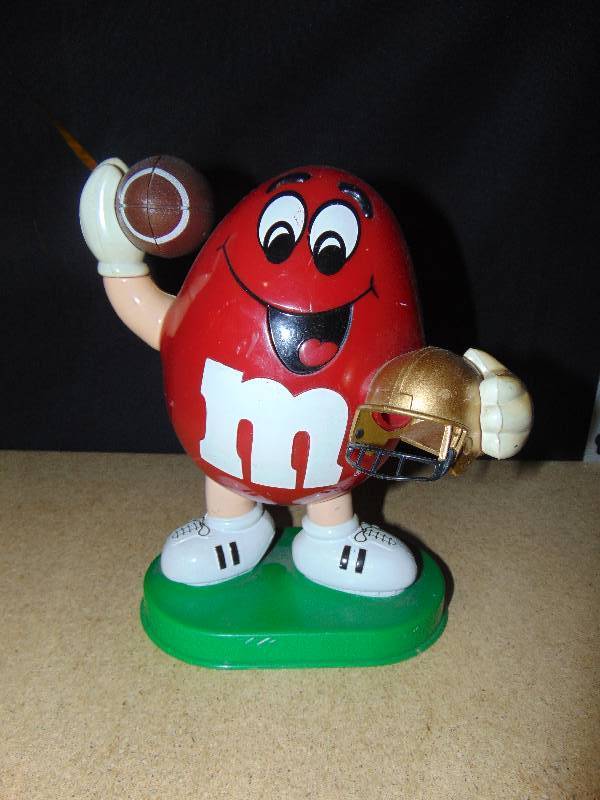 lot 4112 image: Football Player Red M&Ms Dispenser, 10 tall 1995