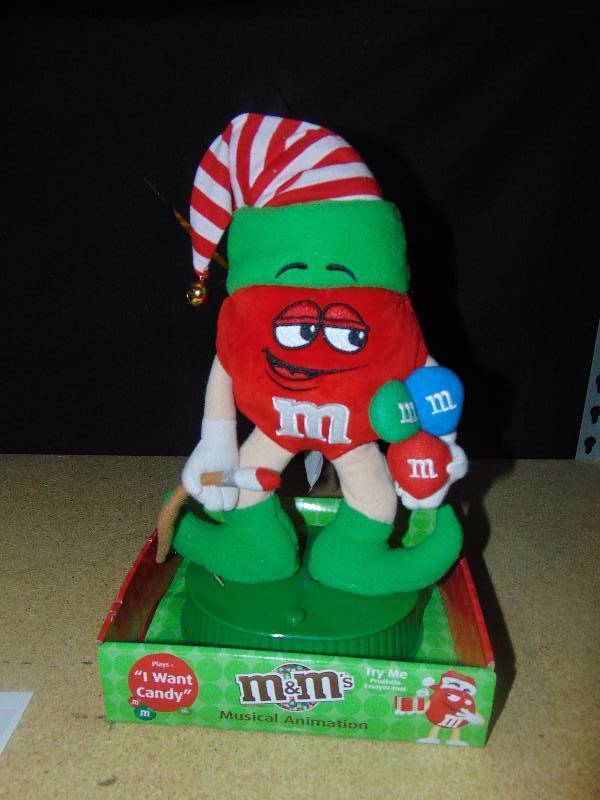 lot 4115 image: M&M Candy Elf, Plays I want Candy-- batteries not included.