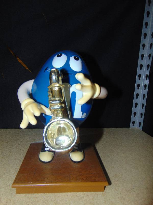 lot 4118 image: Blue with Saxophone M&Ms Candy Dispenser, 10 tall