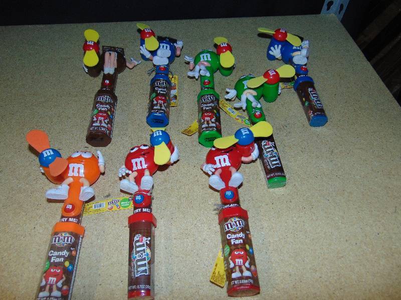lot 4129 image: (8) ct. lot M&Ms Candy fans Red, Blue, Green, Brown, Orange