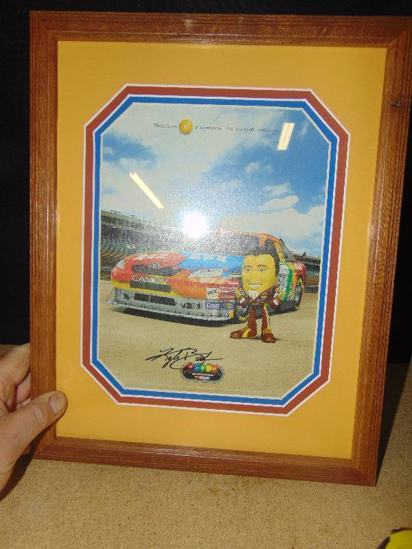 lot 4131 image: M&Ms Kyle Bush #18 advertising picture, professionally matted and framed, 12 x 15