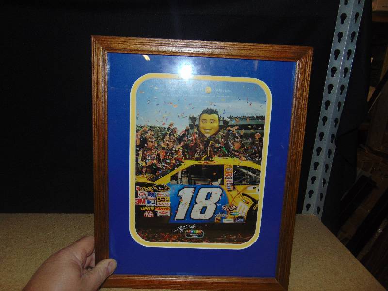 lot 4136 image: M&Ms Kyle Bush #18 winners Circle  advertising picture, professionally matted and framed, 12 x 15