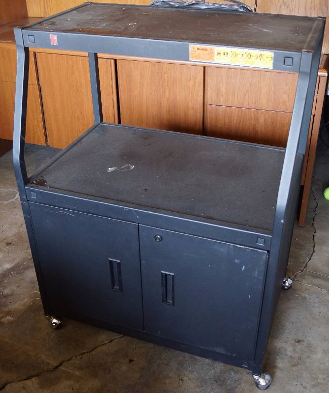 lot 2405 image: Rolling Media Cart with 2 Shelves and Storage - Electric outlets on back