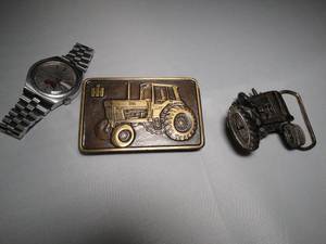 lot 23039 image: 2 Tractor Buckles (1 International Harvester) & Bulova Accutron Tractor Watch  Lot