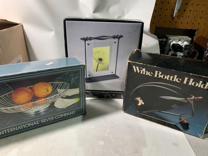 lot 146 image: Kitchen Decorative Bundle Wine Bottle Holder, Silver Company Fruit Basket, and Umbra Vintage Photo Frame