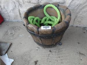 lot 23597 image: Concrete flower pot w garden hose