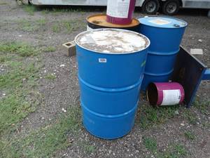 lot 23657 image: Several metal 5 gallon & 55 gallon barrels