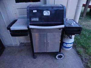 lot 23698 image: Weber Grill With Propane Bottle.