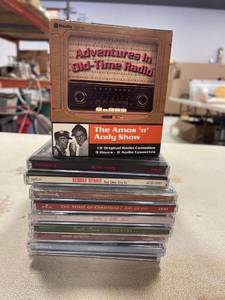 lot 64423 image: misc hallmark cds, ACDC, George strait, Amos and Andy show (cassettes)