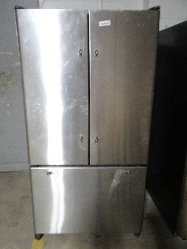 lot 164 image: Kemmre refrigeratorfreezer lights up. only freezer works.