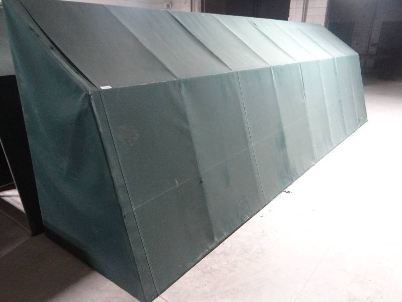 lot 166 image: Large aluminum frame canopyawming. green fabric cover. 6ft tall 4 ft deep 20ft long.