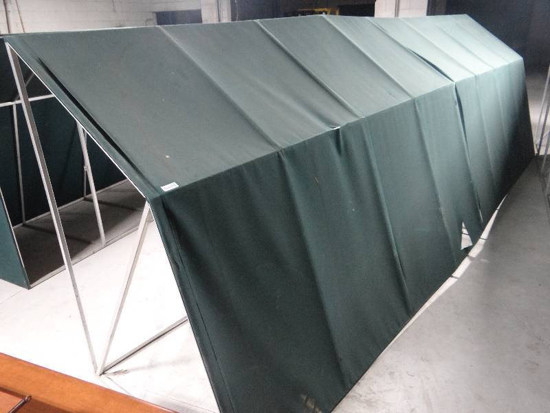 lot 169 image: Large aluminum frame canopyawning. green fabric cover.  6ft tall 4 ft deep 20ft long.