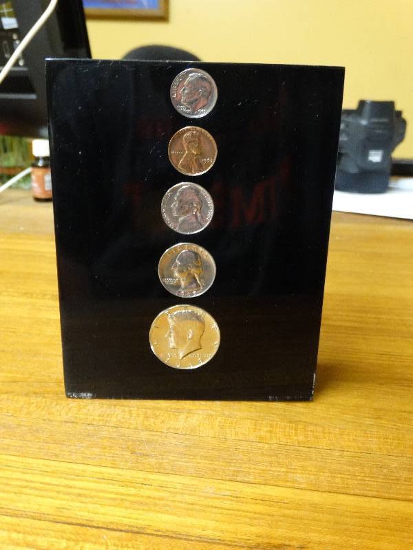 lot 535 image: 5 Coins in lucite.