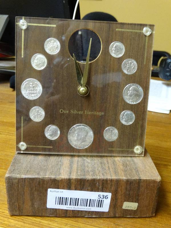 lot 536 image: Our Silver Heritage. (11) coin desk clock