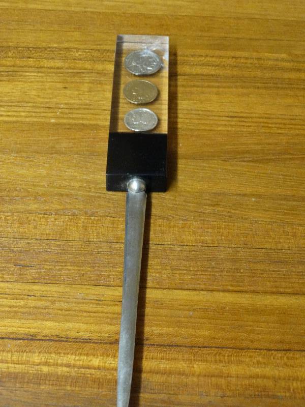lot 550 image: 3 Coin lucite letter opener 1902, 1936, 1942.