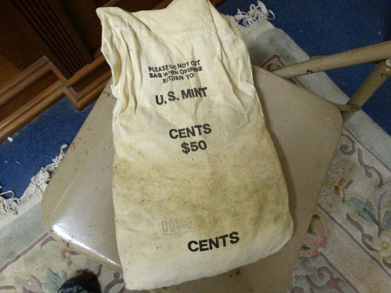 lot 561 image: $50 bag of pennies unopened from the mint bag stamped 1982.