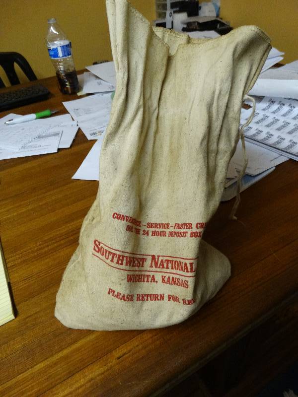 lot 563 image: Bank bag wlarge lot of unsearched pennies.