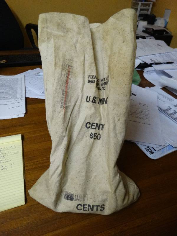 lot 564 image: Bank bag wlarge lot of unsearched pennies.