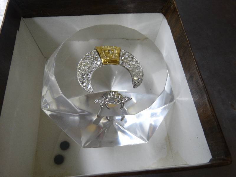 lot 572 image: Midian shrine lucite diamond shape.