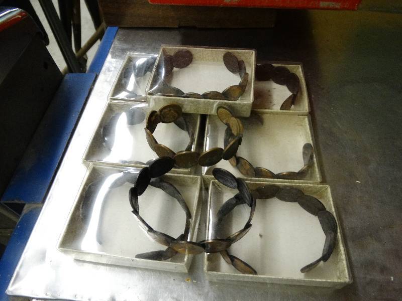lot 597 image: Lot of 9 pennies bracelets.
