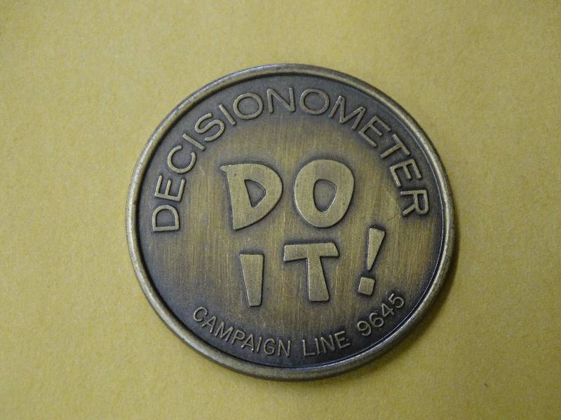 lot 601 image: Decision ometer coin.
