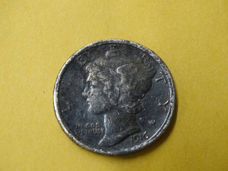 lot 603 image: Large 1916 Dime (penny in pic for size).
