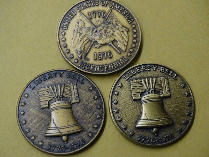 lot 606 image: 3 Liberty bell coins.