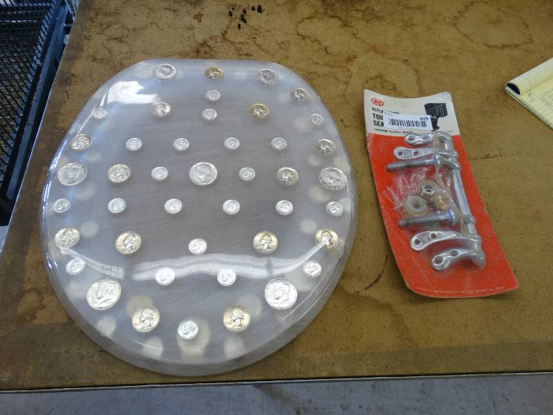Lucite toilet seat set w/78 silver coins. All coins are 1964 or older
