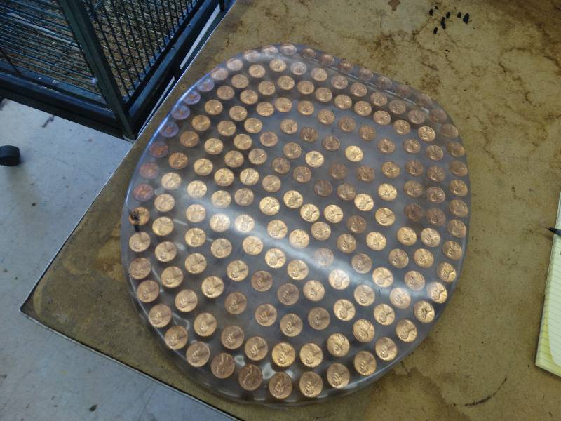 lot 611 image: Lucite toilet seat lid w1976 Lincoln pennies.