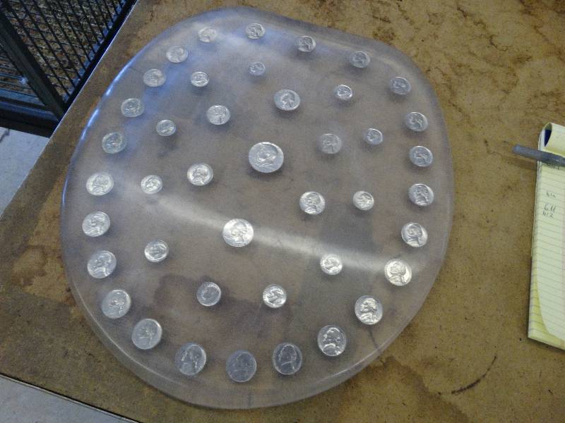 lot 612 image: Lucite toilet seat lid w45 coins.