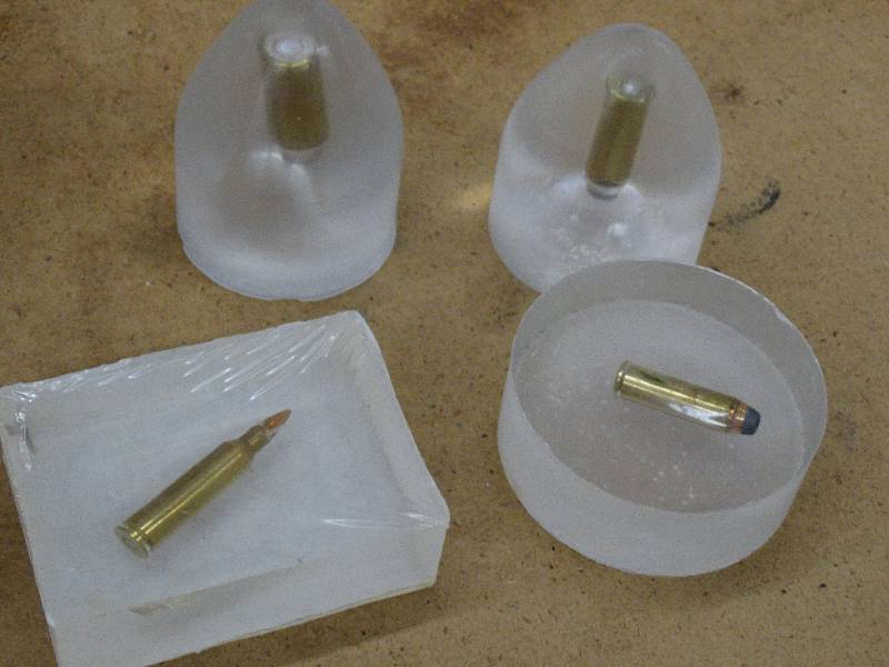 lot 627 image: 4 pcs bullet in lucite.