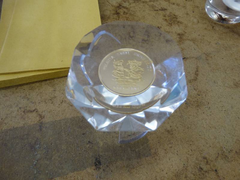 lot 629 image: Diamond shape lucite wWSU coin stand not included.