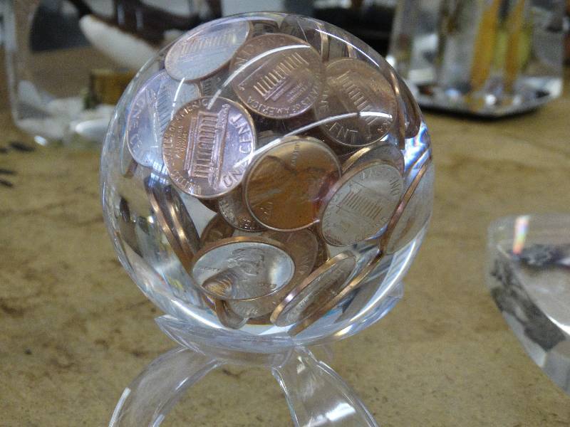 lot 630 image: Lucite sphere wvarious pennies stand not included.