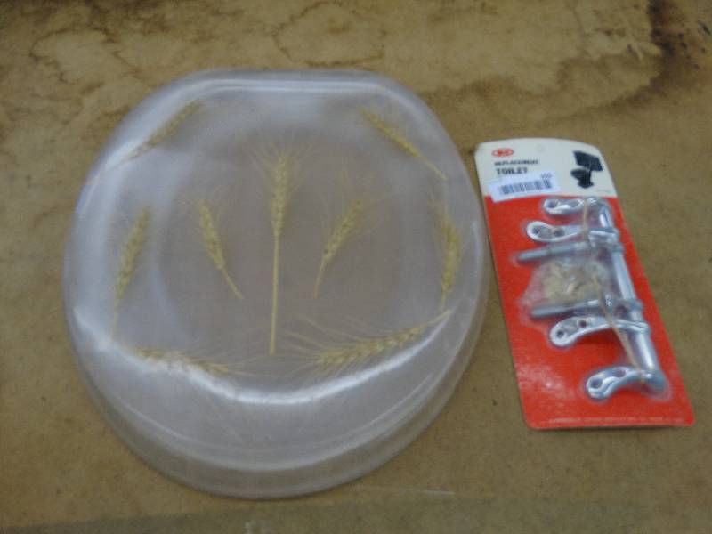 lot 650 image: Lucite wheat in toilet seat whinge.