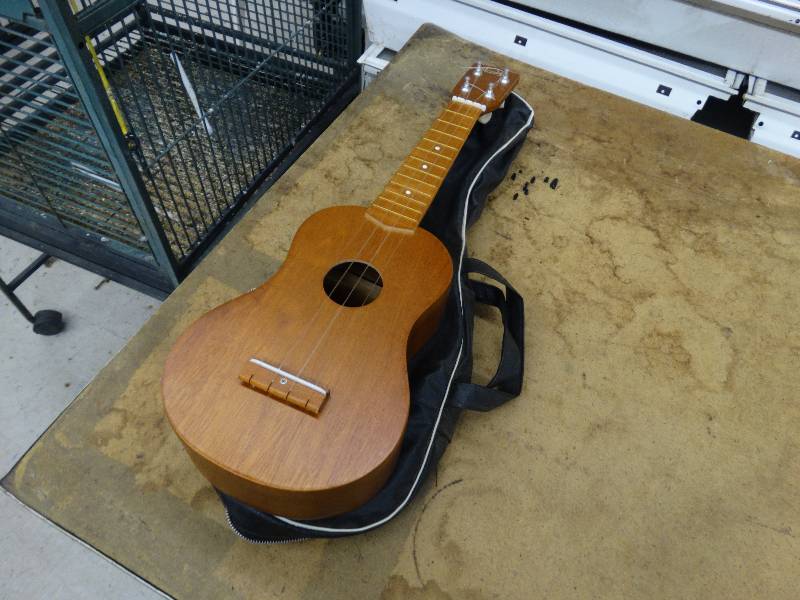 lot 652 image: Norma small guitar wcase.