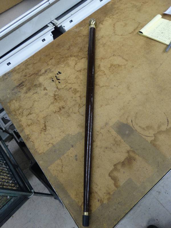 lot 653 image: Vintage prohibition cane wliquor test tube inside.