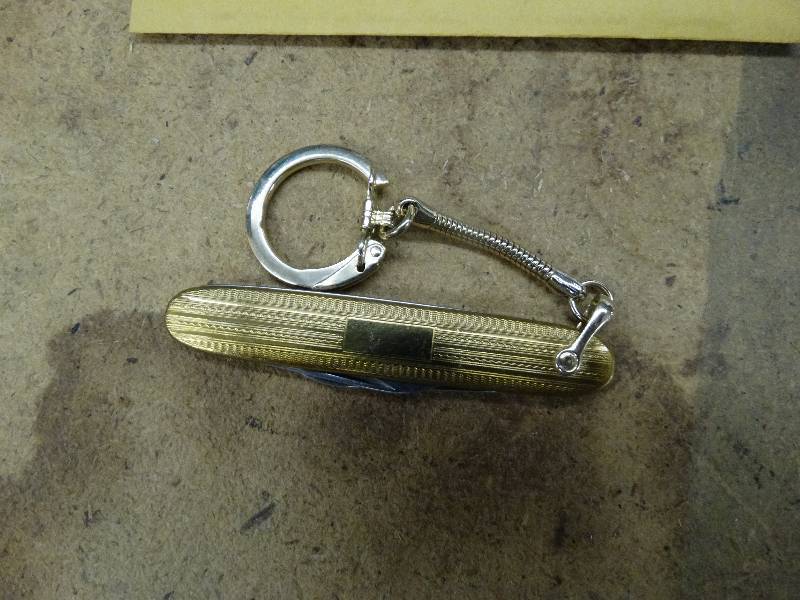 lot 664 image: Colonial gold - tone pocket knife.