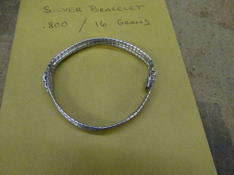 lot 665 image: Silver bracket - 16G.