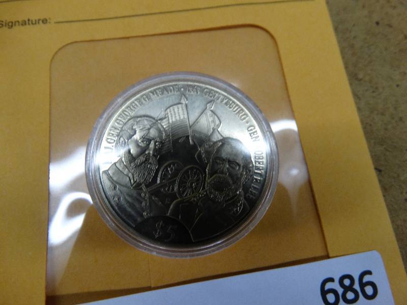 lot 686 image: 2001 Liberia coin in plastic.