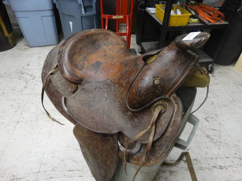 lot 113 image: Leather horse saddle with stirrups