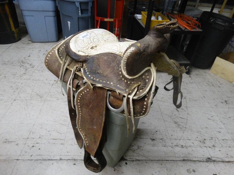 lot 114 image: Leather horse saddle with stirrups
