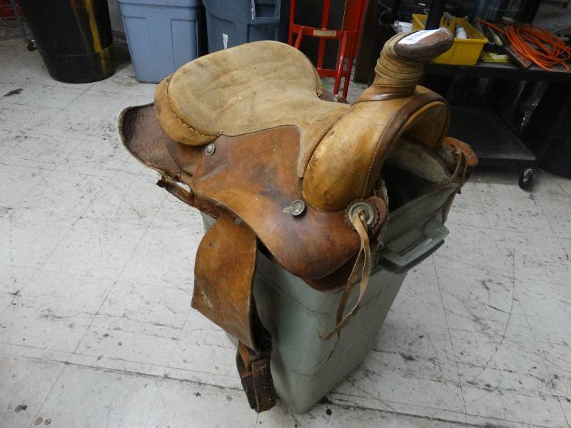 lot 115 image: Leather horse saddle with stirrups