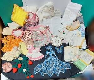 lot 38302 image: Crocheted work, vintage Hankies, hotpads, vintage baby shirt & lots more
