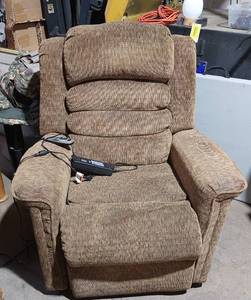 lot 38327 image: Brown Cloth Lift Chair. Lift-and-tilt position for standing up to a lay-flat position. With Heat & Massage. needs cleaned, but a very nice comfortable chair.