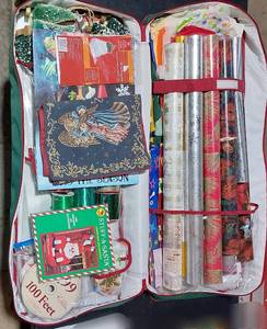 lot 38331 image: Large Canvas Christmas Storage Bag. Full of rolls of wrapping paper, tissue paper, bags, ribbon, tags, decor