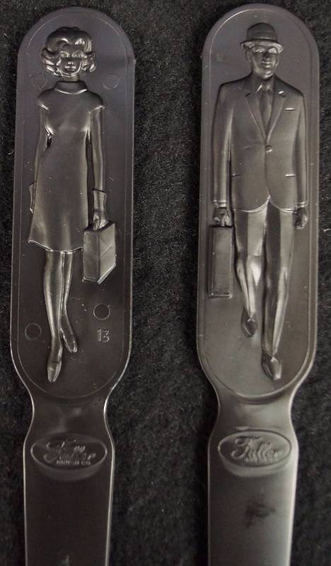 lot 8282 image: 23 Vintage 1950s-60s Black Plastic Letter Openers from the Fuller Brush Company of Hartford, Connecticut.
