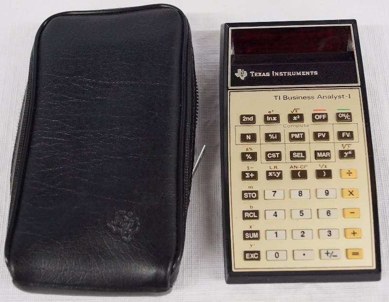 lot 8302 image: Vintage Texas Instruments TI Business Analyst - I Calculator - with Case & Manuals